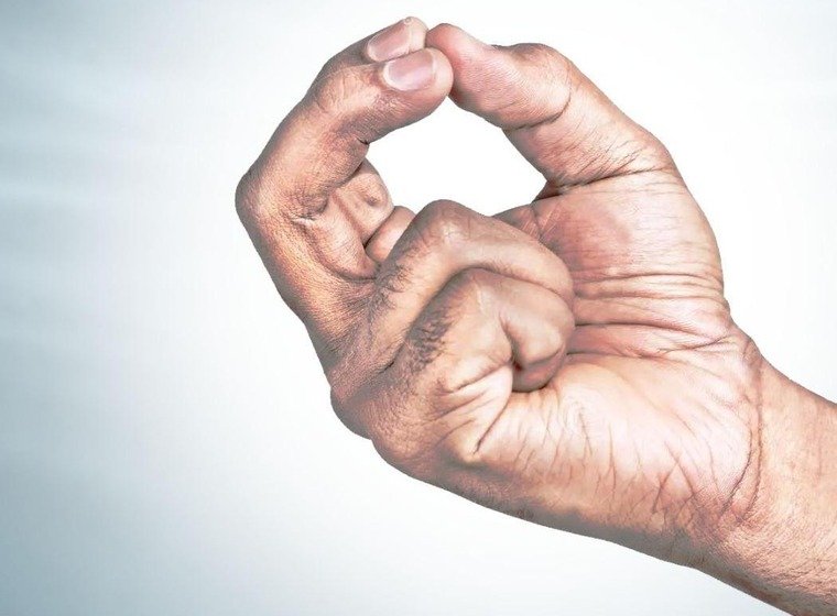 Kubera Mudra hand gesture, thumb index and middle finger touching